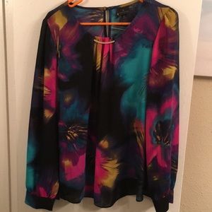 Floral patterned chiffon top with long sleeves.